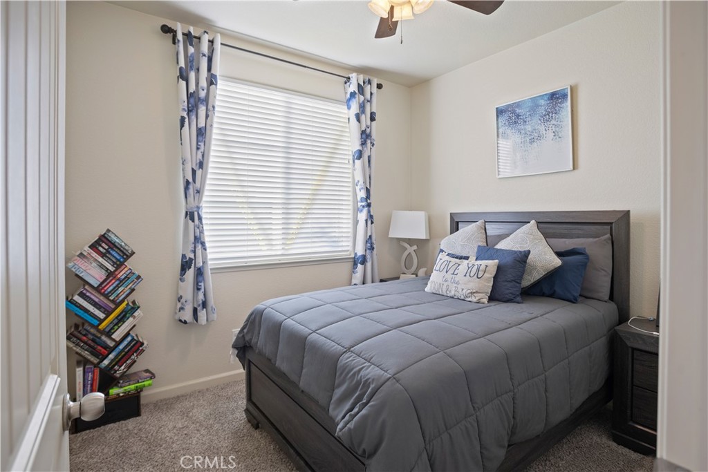 4440 Lindsey Lane Merced, CA 95348 - Photo 15 of 23 a bedroom with a bed and a painting on the wall