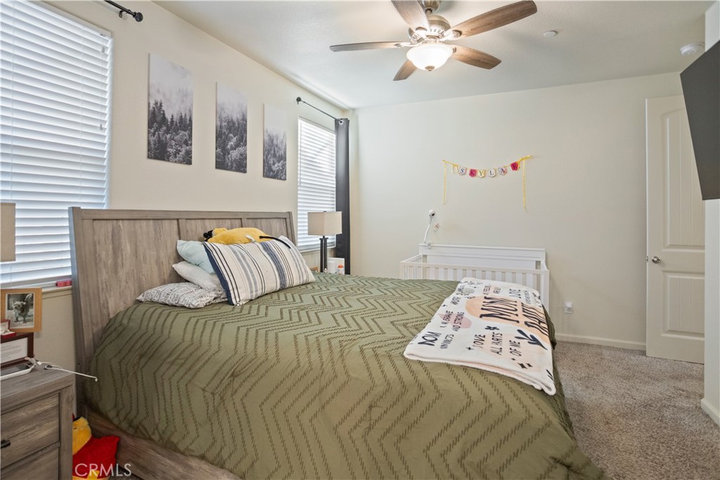 4440 Lindsey Lane Merced, CA 95348 - Photo 19 of 23 a bedroom with a bed and painting on the wall