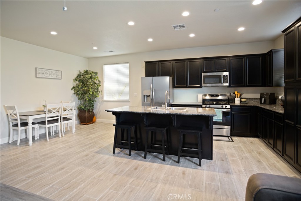 4440 Lindsey Lane Merced, CA 95348 - Photo 9 of 23 a kitchen with a table and chairs in it