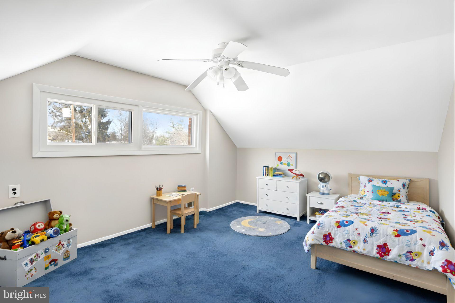 841 Bowie Road Rockville, MD 20852 - Photo 11 of 18 a bedroom with a bed and a chandelier