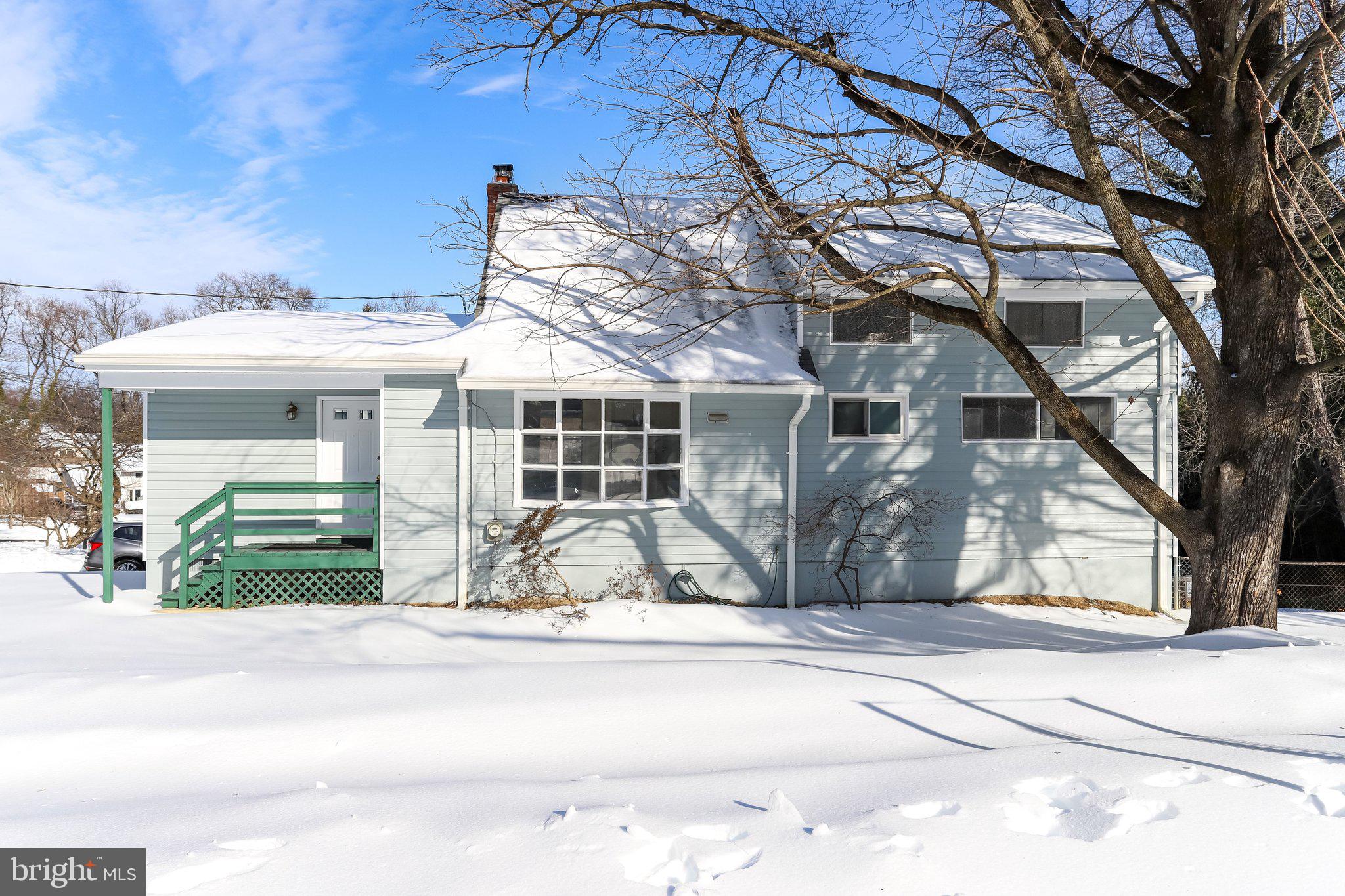 841 Bowie Road Rockville, MD 20852 - Photo 18 of 18 a view of a house with a large tree and wooden fence