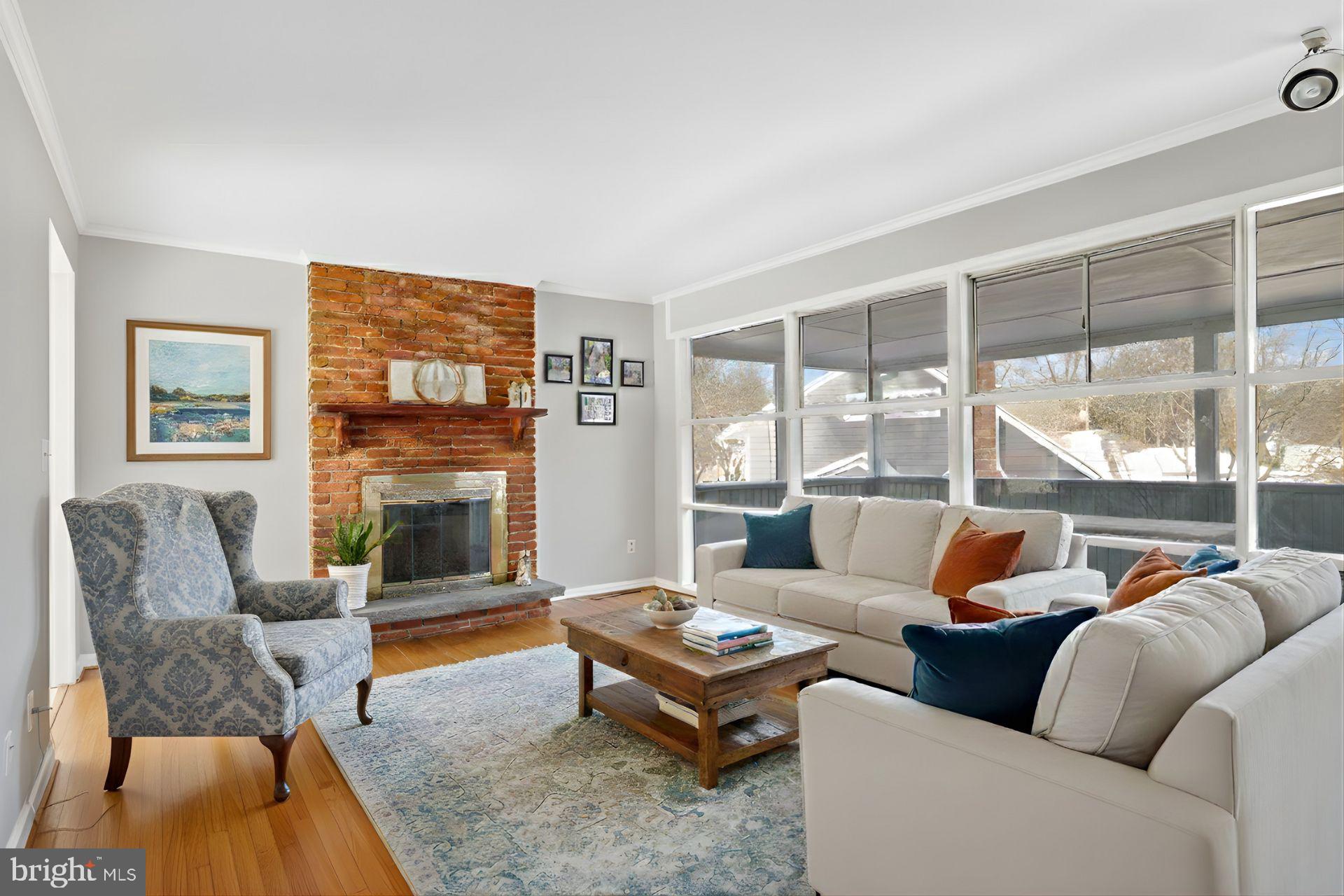 841 Bowie Road Rockville, MD 20852 - Photo 3 of 18 a living room with furniture large window and a fireplace
