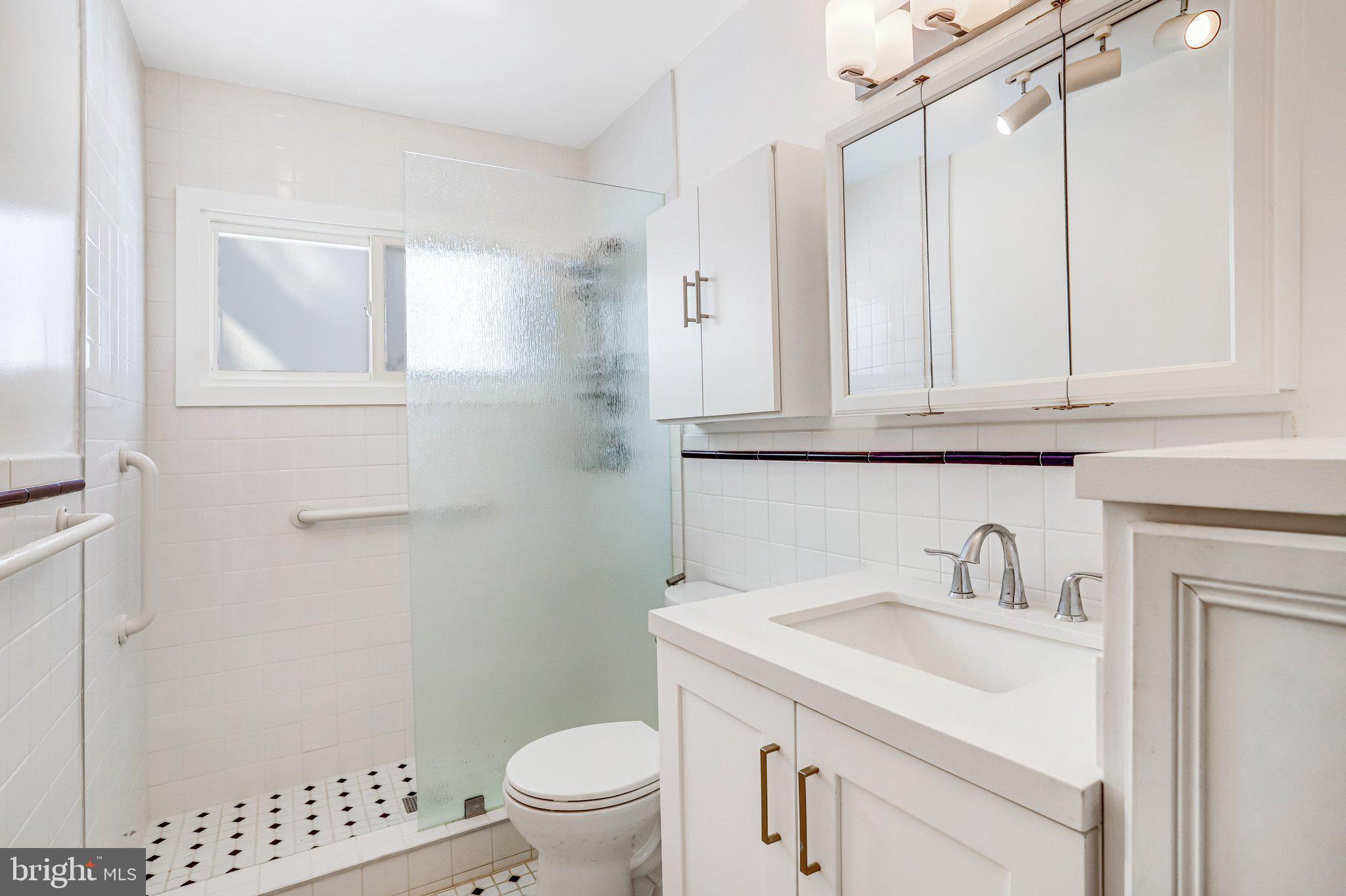 841 Bowie Road Rockville, MD 20852 - Photo 7 of 18 a bathroom with a sink a toilet and shower