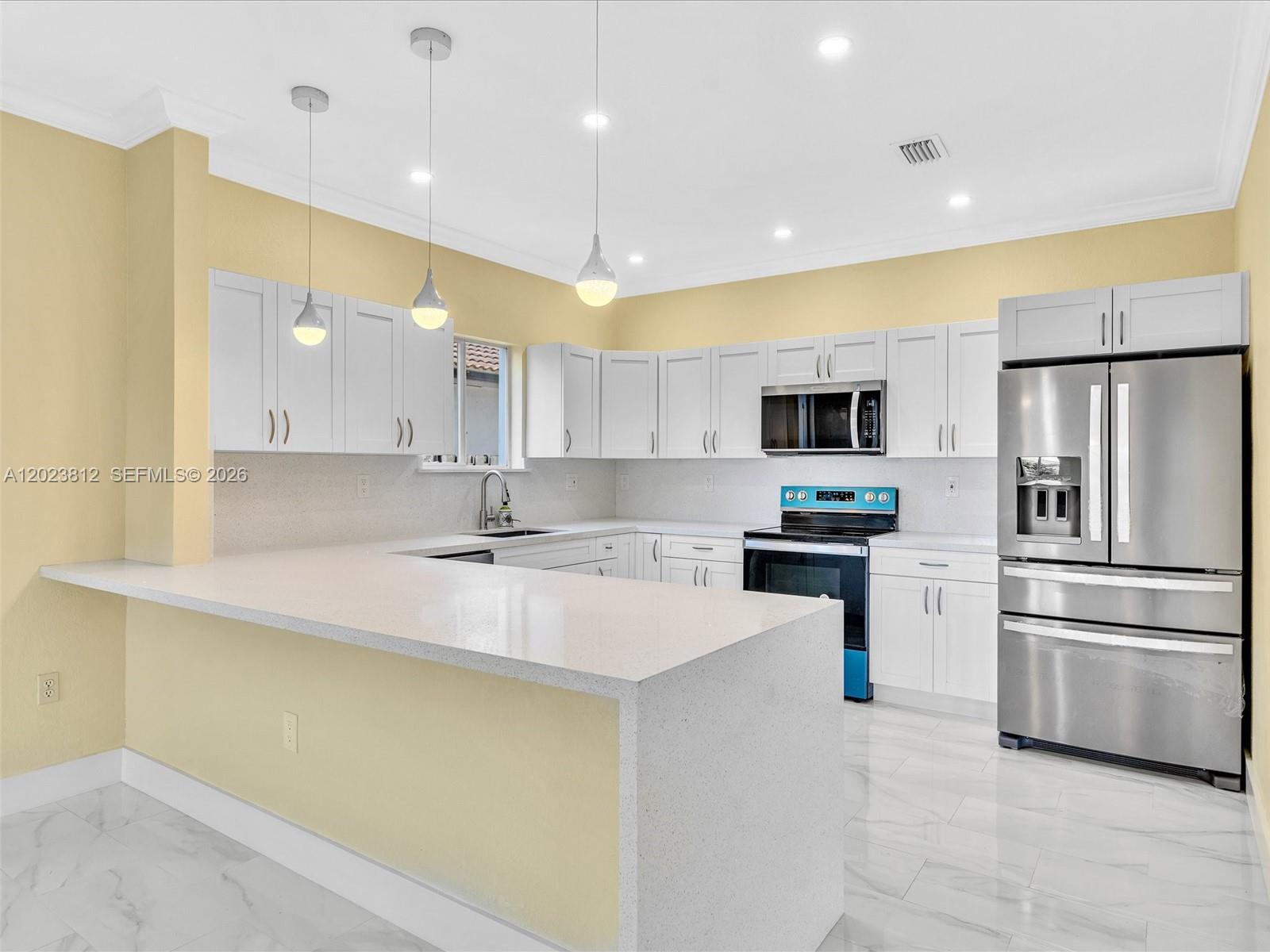 2864 Southwest 138th Path Miami, FL 33175 - Photo 16 of 40 a kitchen with a sink stainless steel appliances and cabinets