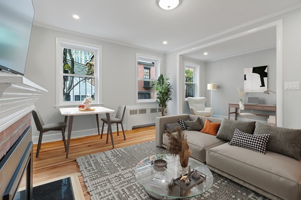 12 Fayette Street, Unit 2 Boston, MA 02116 - Photo 2 of 8 a living room with furniture and a large window