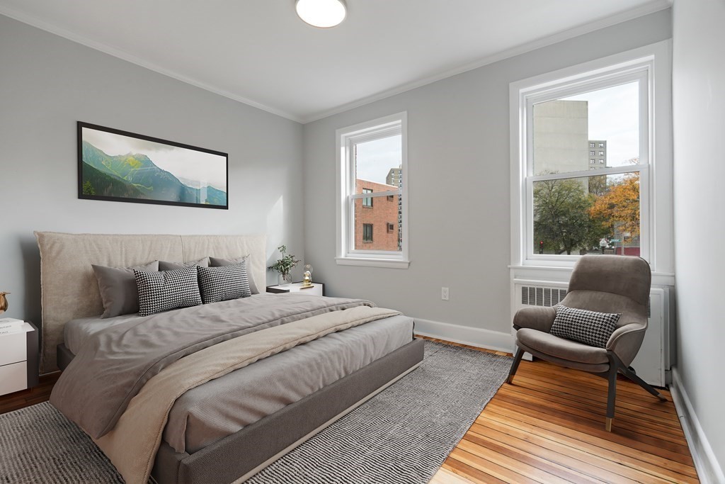 12 Fayette Street, Unit 2 Boston, MA 02116 - Photo 5 of 8 a bedroom with a bed and wooden floor