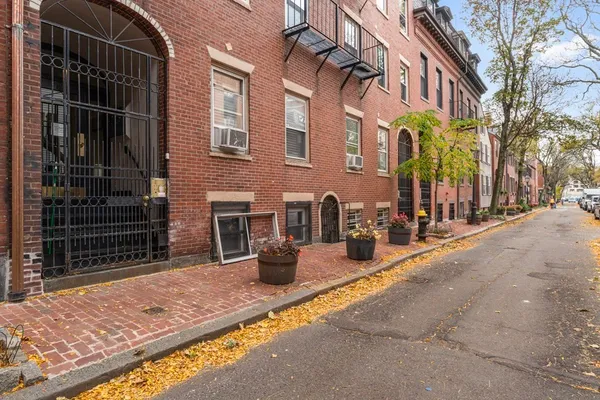 a view of a brick building with many windows