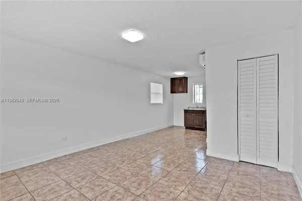 an aerial view of a house with a lake view