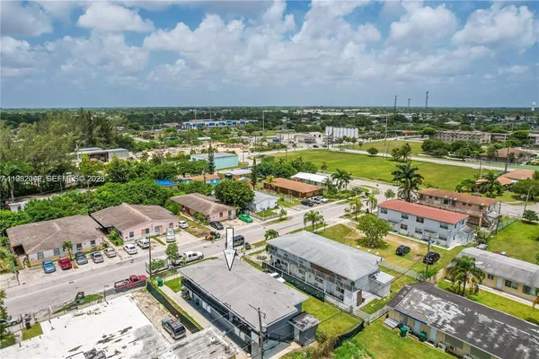 an aerial view of residential houses with outdoor space