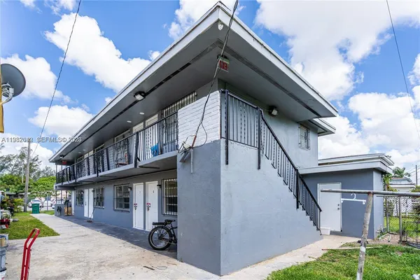 a view of a white building among the street