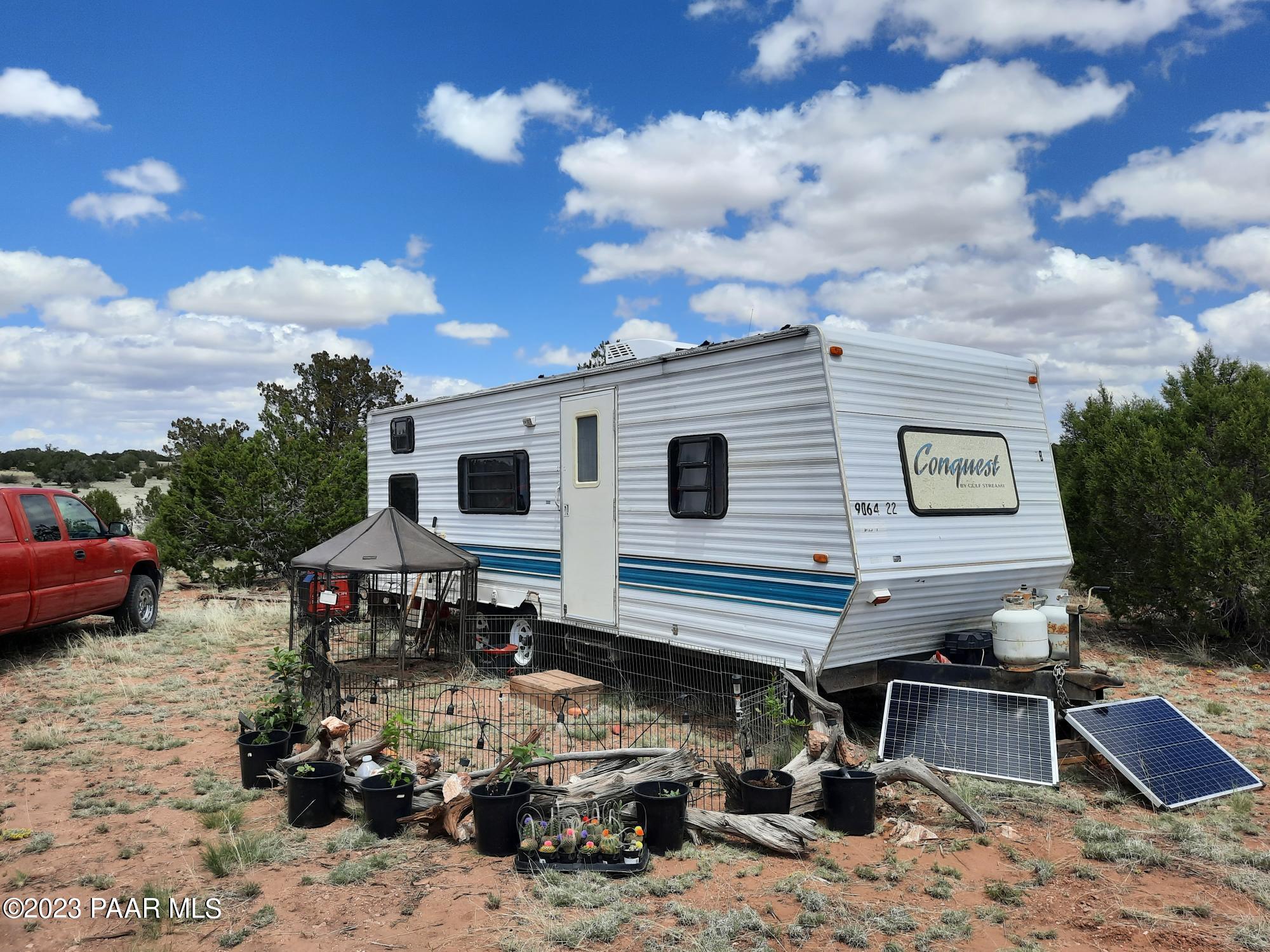 103 B Antelope Run Road Seligman, AZ 86337 - Photo 1 of 17 a view of a house with a patio