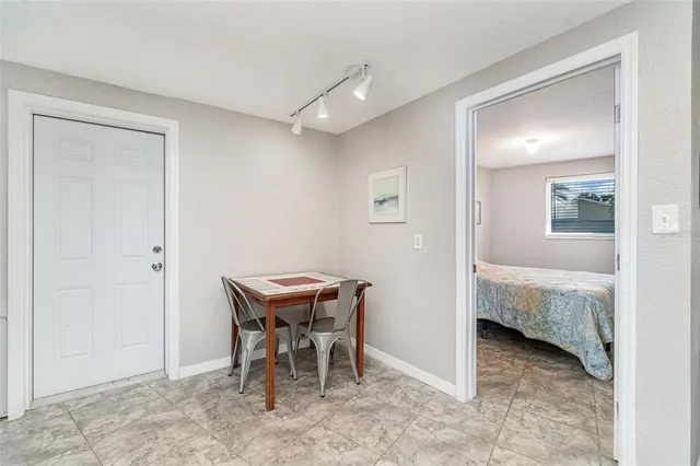 a view of a room with furniture and wooden floor