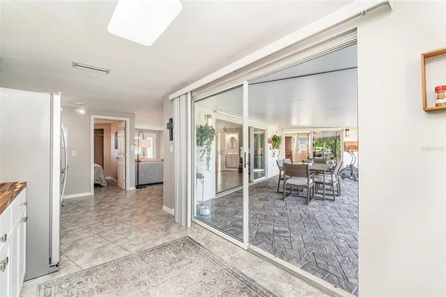 a view of a livingroom with furniture and an entryway