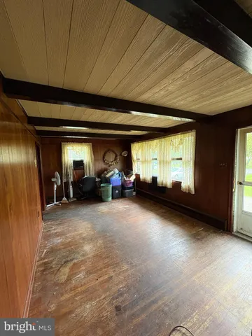 a view of living room with furniture and a window
