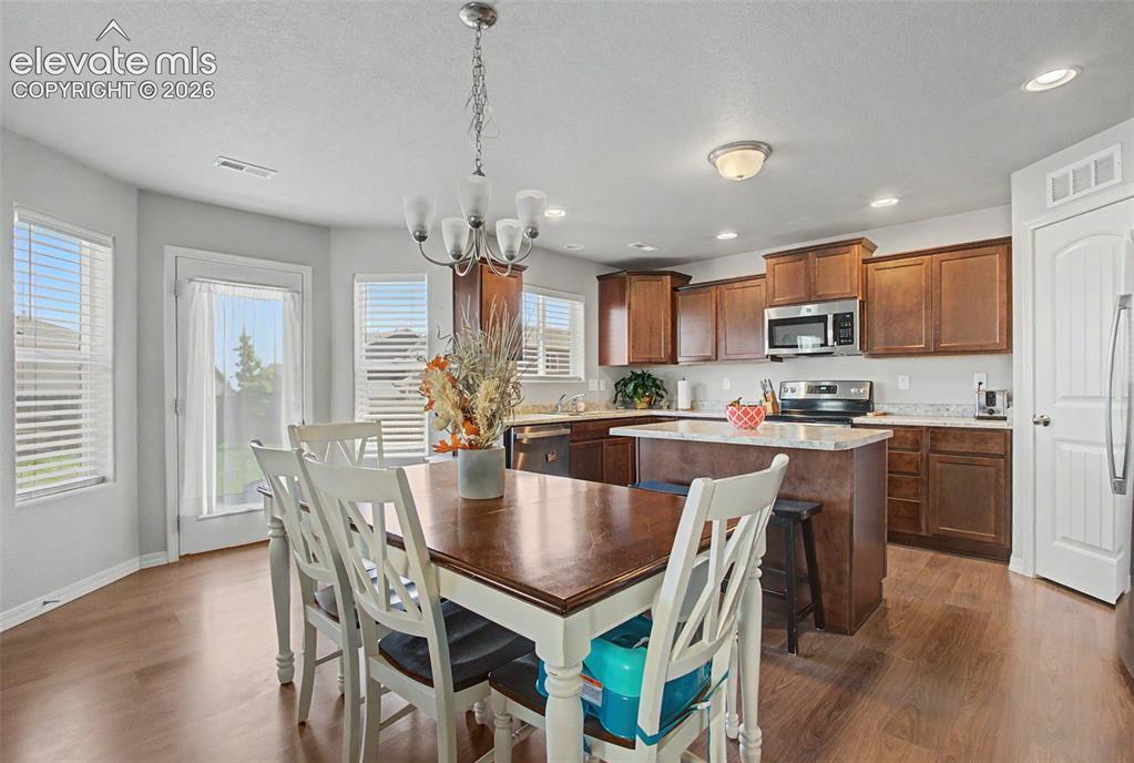 10957 Avena Road Peyton, CO 80831 - Photo 10 of 34 Dining area with walkout to backyard