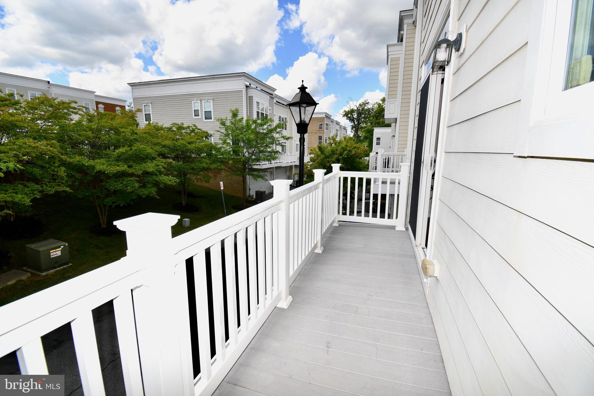 11665 Leesborough Circle Silver Spring, MD 20902 - Photo 39 of 82 a view of a brick house with wooden fence