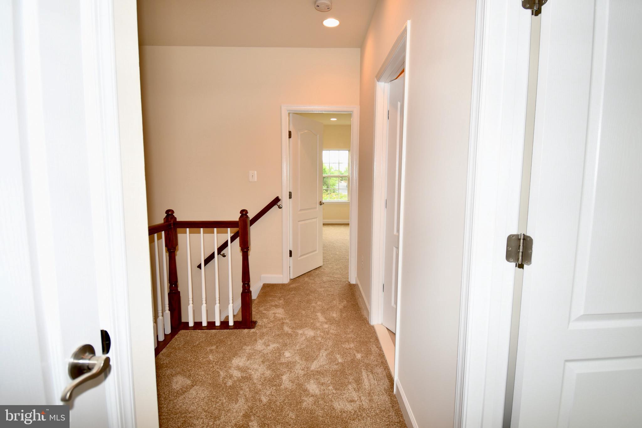 11665 Leesborough Circle Silver Spring, MD 20902 - Photo 44 of 82 a view of a hallway with wooden floor and staircase