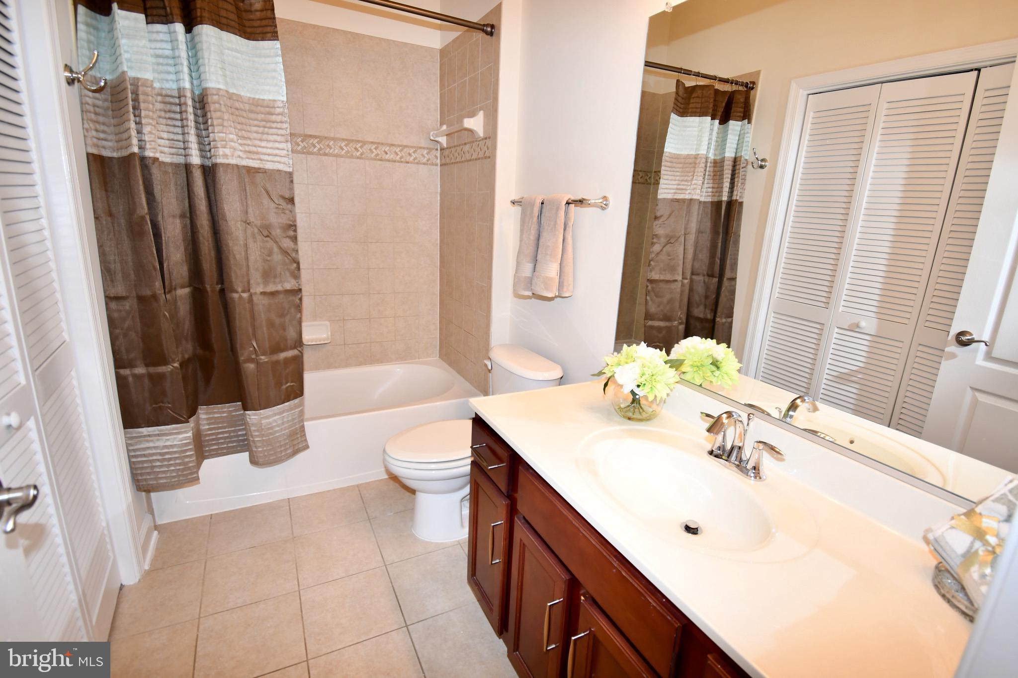 11665 Leesborough Circle Silver Spring, MD 20902 - Photo 58 of 82 a bathroom with a sink a toilet and shower