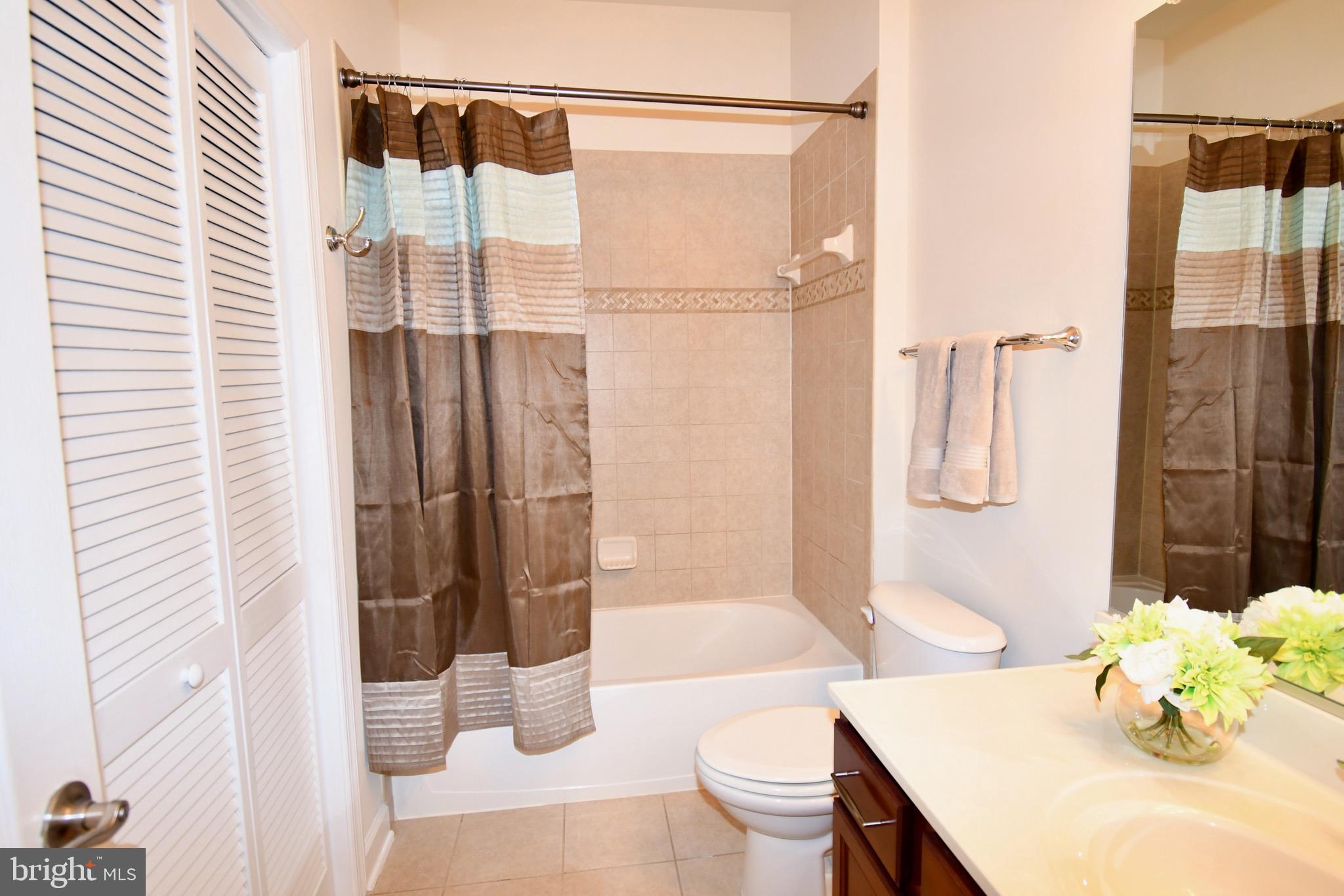 11665 Leesborough Circle Silver Spring, MD 20902 - Photo 59 of 82 a bathroom with a sink toilet and shower