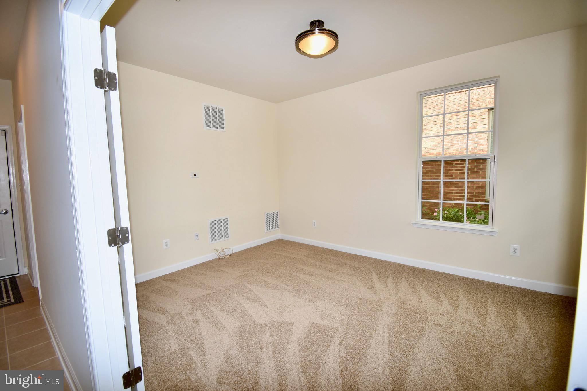 11665 Leesborough Circle Silver Spring, MD 20902 - Photo 76 of 82 an empty room with windows