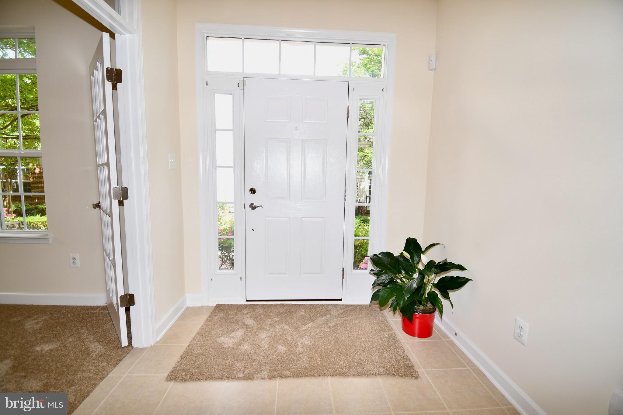 11665 Leesborough Circle Silver Spring, MD 20902 - Photo 78 of 82 a view of a hallway with a flower pot