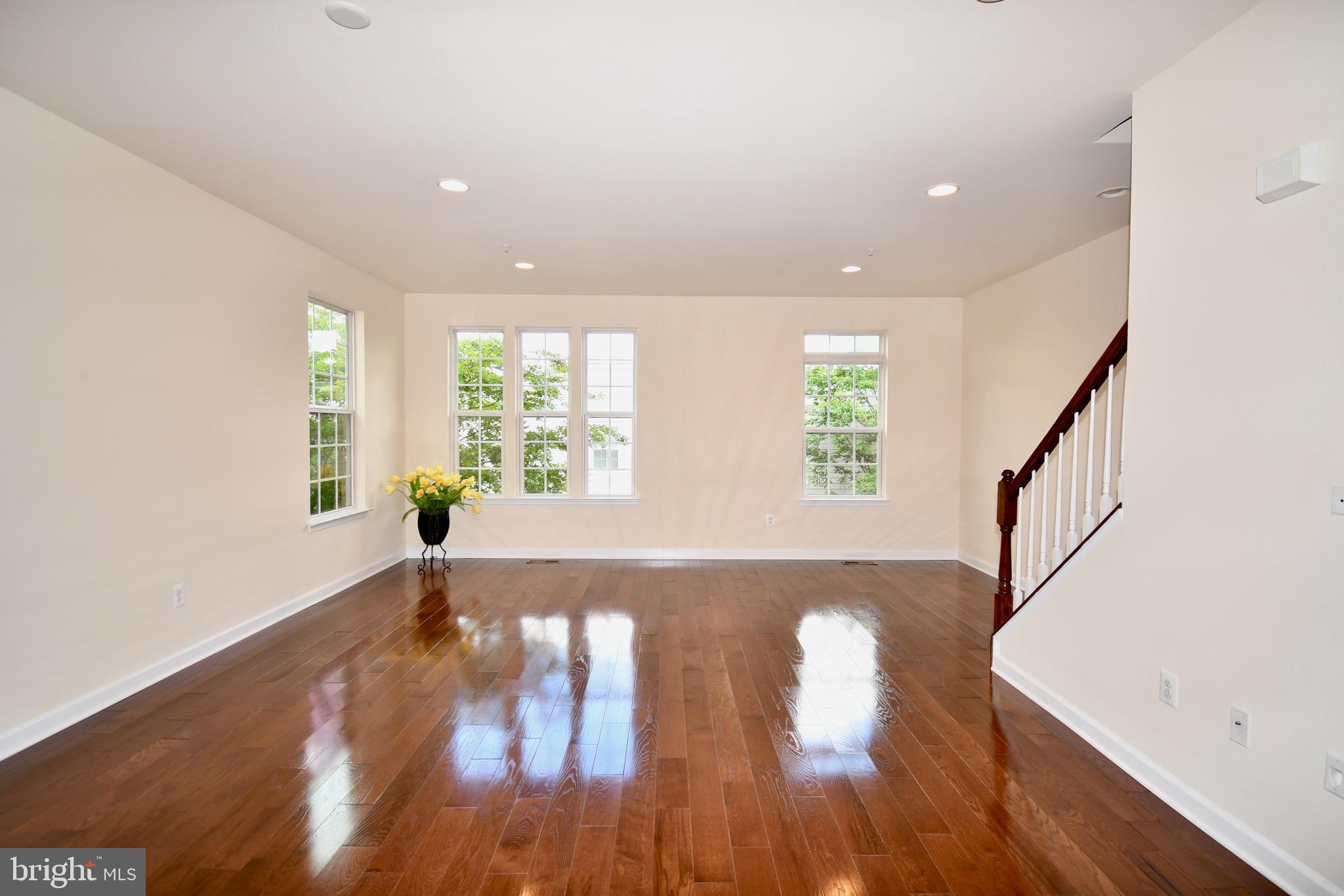 11665 Leesborough Circle Silver Spring, MD 20902 - Photo 10 of 82 a view of empty room with wooden floor and fan