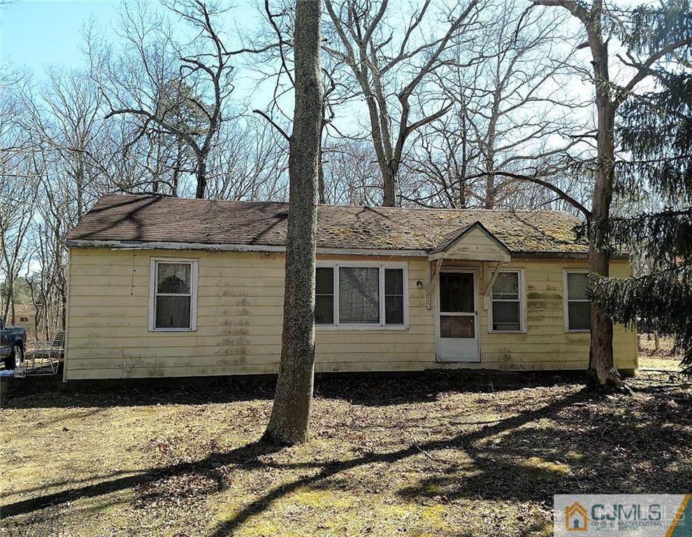 a front view of a house with trees