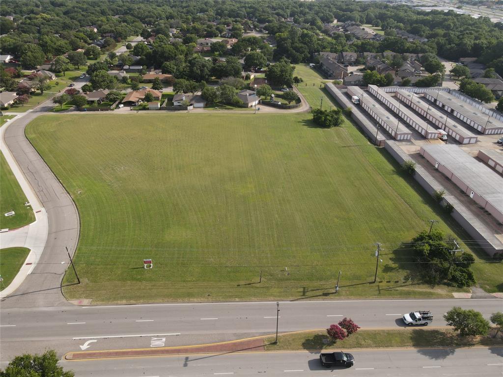 1101 East Belt Line Road DeSoto, TX 75115 - Photo 2 of 3 Expansive land parcel featuring a manicured lawn, road frontage, and established surrounding infrastructure