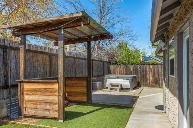 a view of a backyard with sitting area