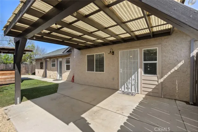 a porch with view of a backyard