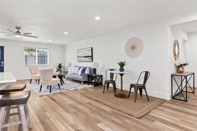 a living room with furniture a rug and a chandelier