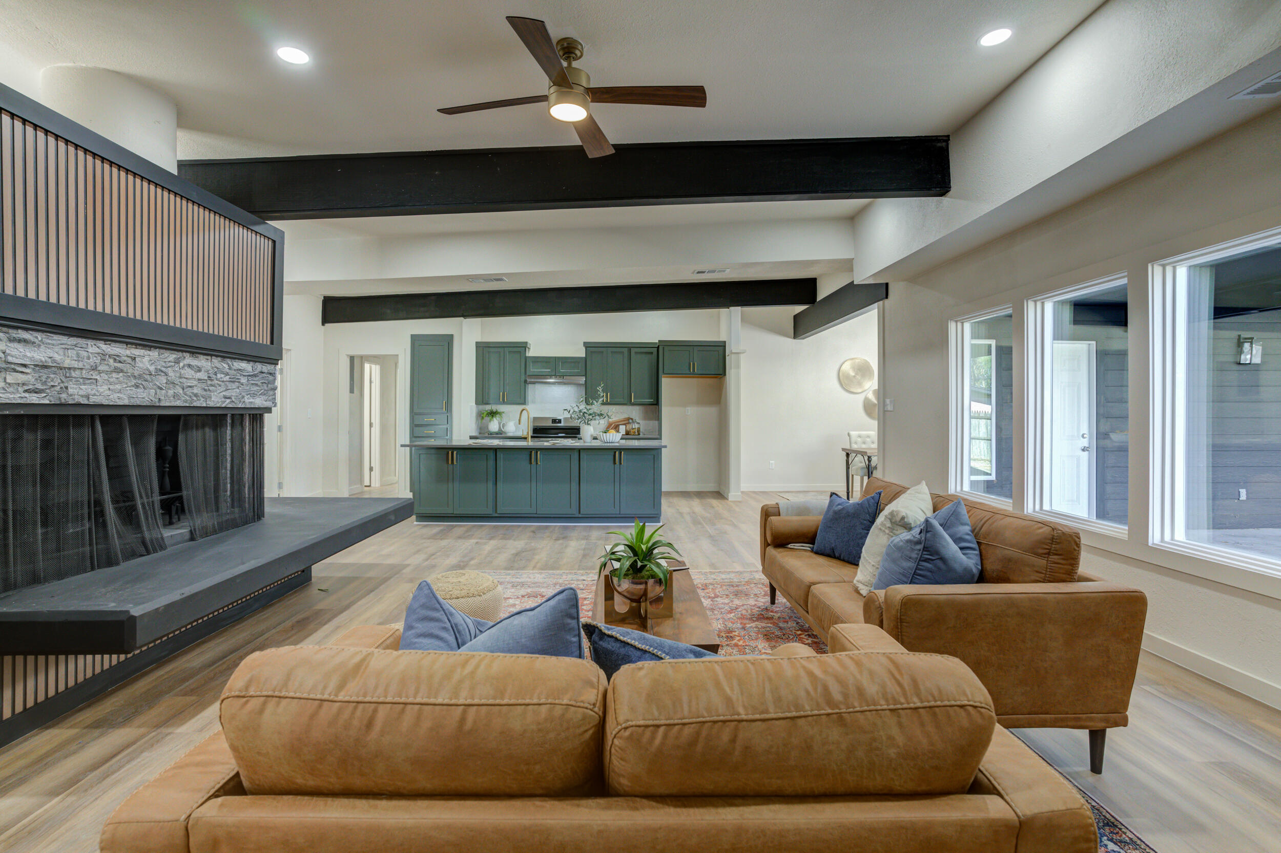 2218 58th Street Lubbock, TX 79412 - Photo 12 of 66 a living room with furniture and a fireplace