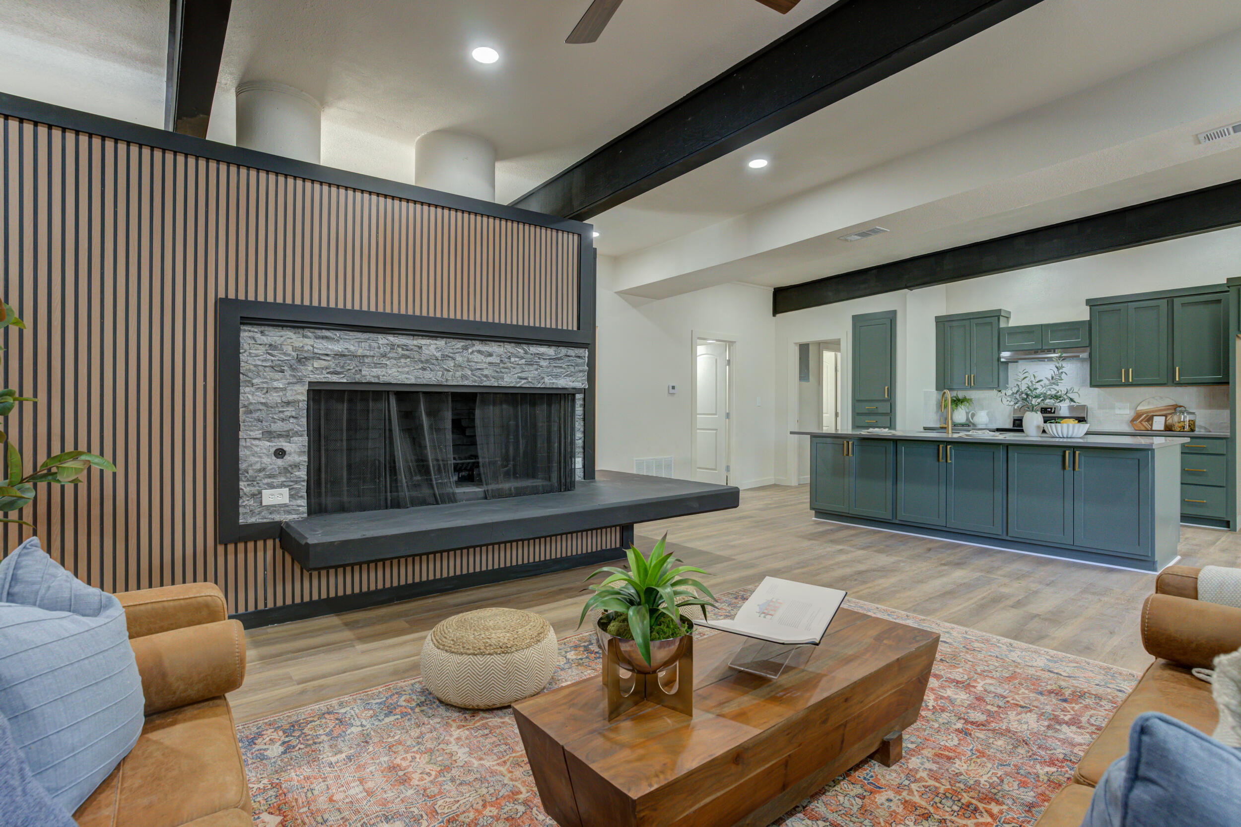 2218 58th Street Lubbock, TX 79412 - Photo 13 of 66 a living room with furniture and a fireplace