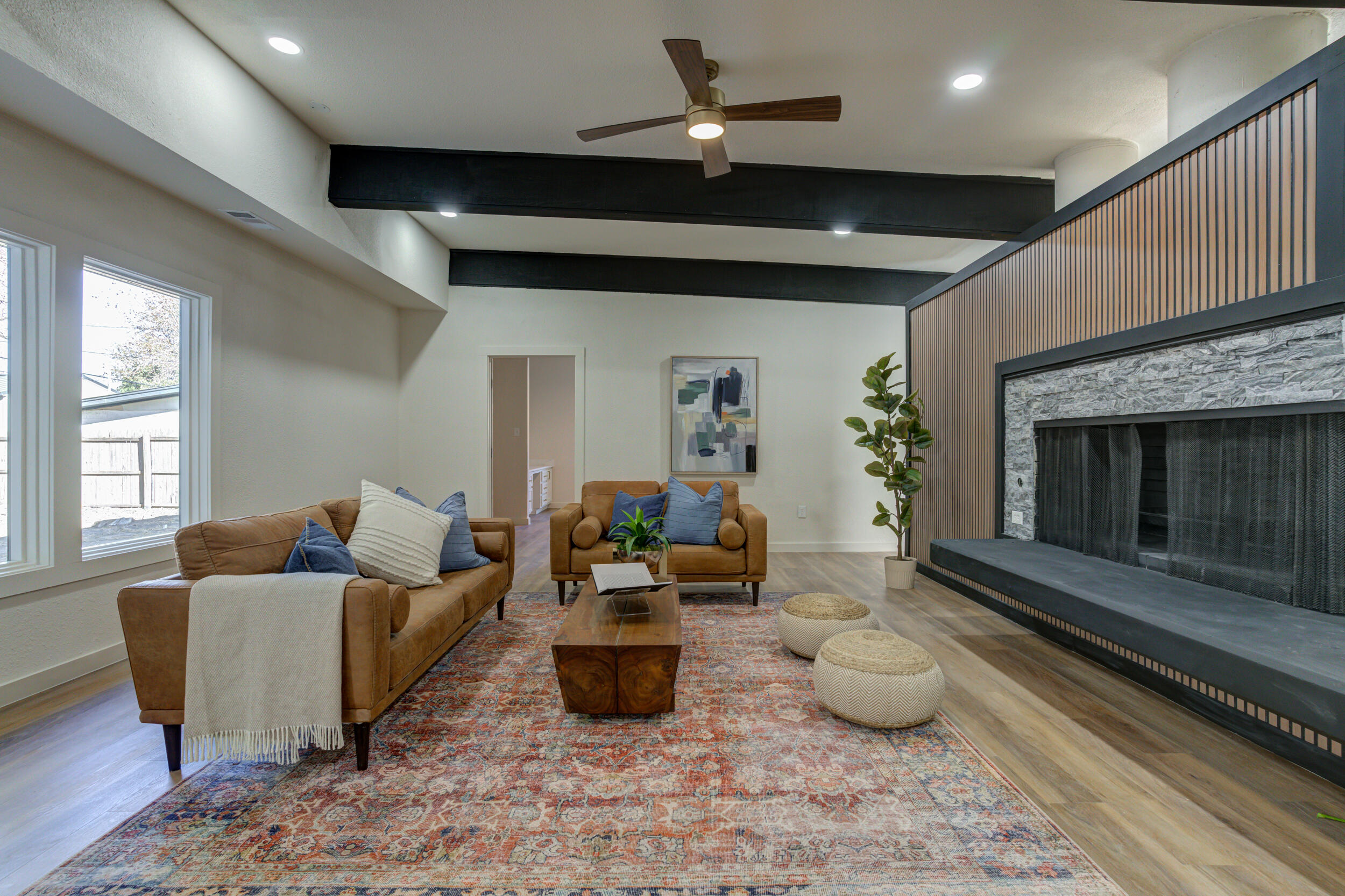 2218 58th Street Lubbock, TX 79412 - Photo 16 of 66 a living room with furniture and a fireplace