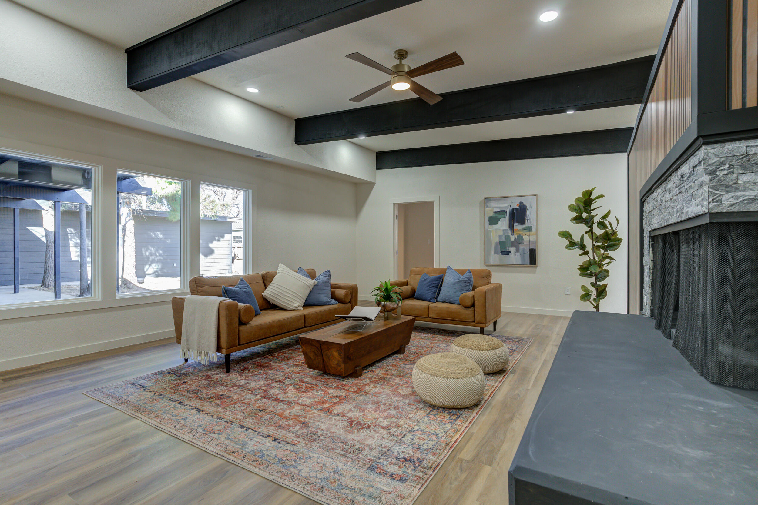 2218 58th Street Lubbock, TX 79412 - Photo 17 of 66 a living room with furniture and a large window