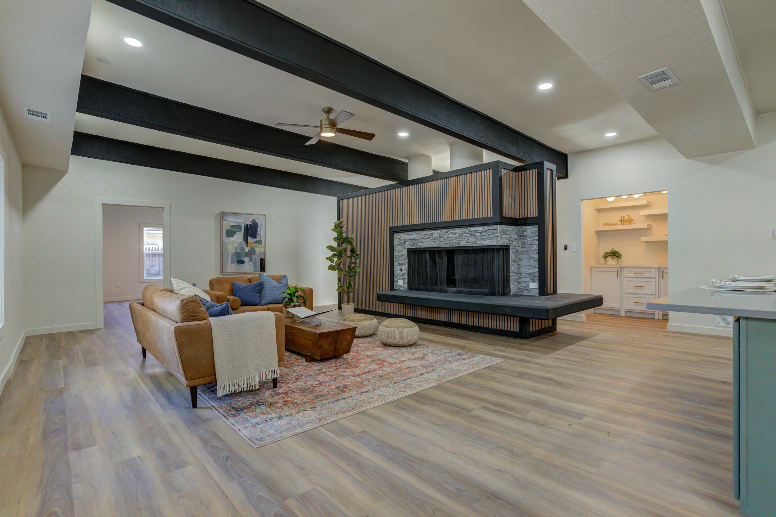 2218 58th Street Lubbock, TX 79412 - Photo 18 of 66 a living room with furniture and a fireplace