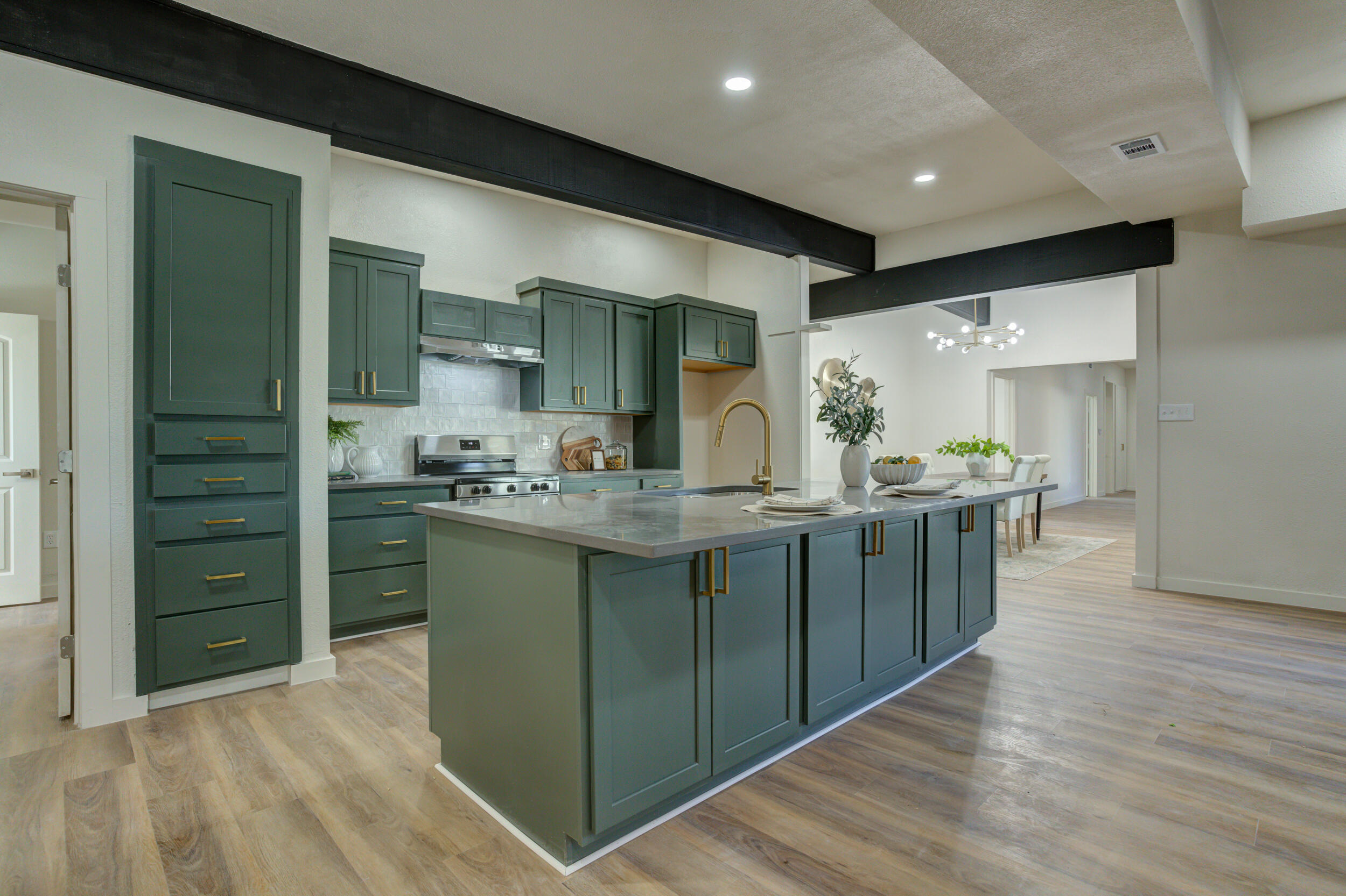 2218 58th Street Lubbock, TX 79412 - Photo 20 of 66 a kitchen with counter top space and wooden floor