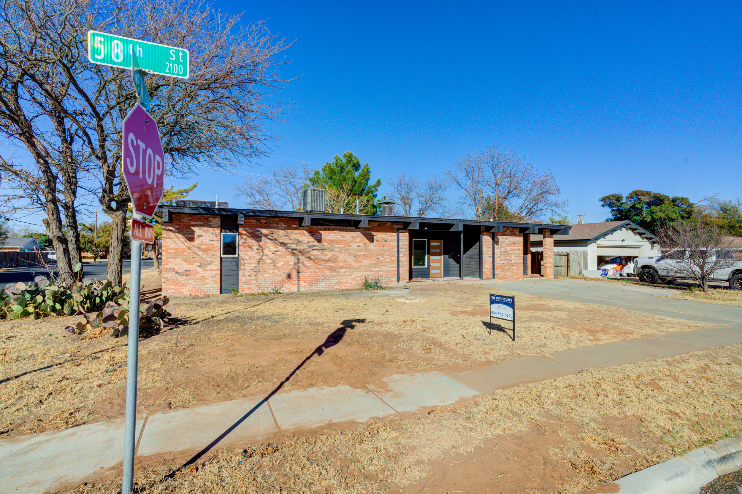 2218 58th Street Lubbock, TX 79412 - Photo 2 of 66 a view of a house with a yard