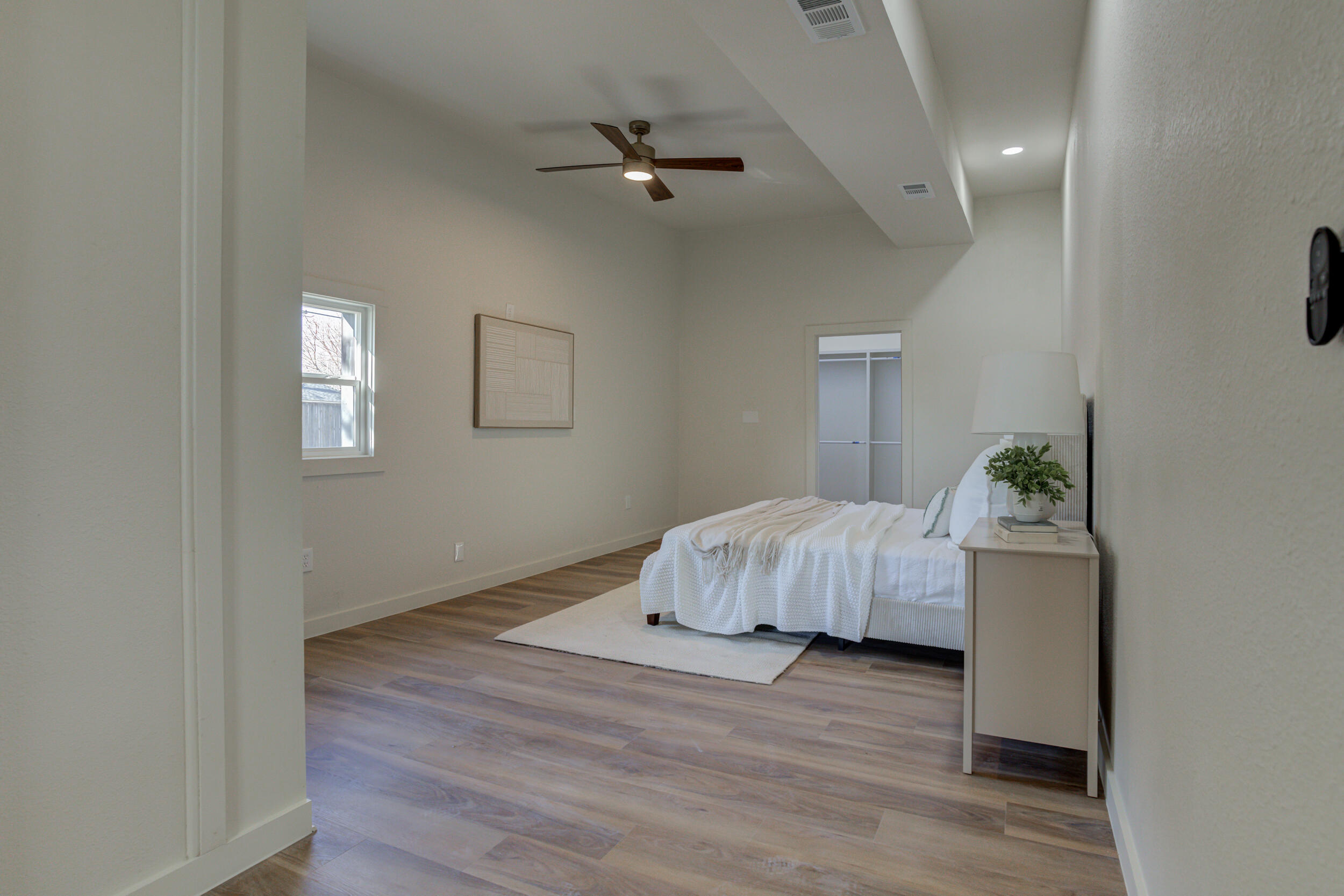 2218 58th Street Lubbock, TX 79412 - Photo 30 of 66 a room with a bed and a dresser