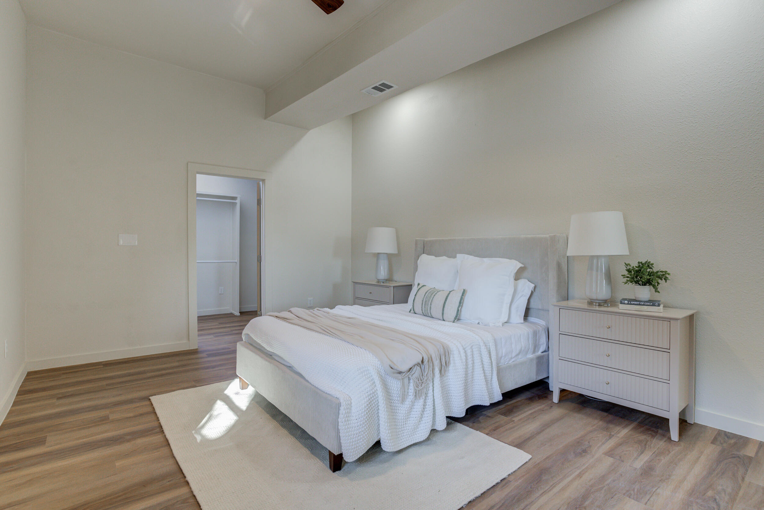 2218 58th Street Lubbock, TX 79412 - Photo 31 of 66 a bedroom with a bed and a table