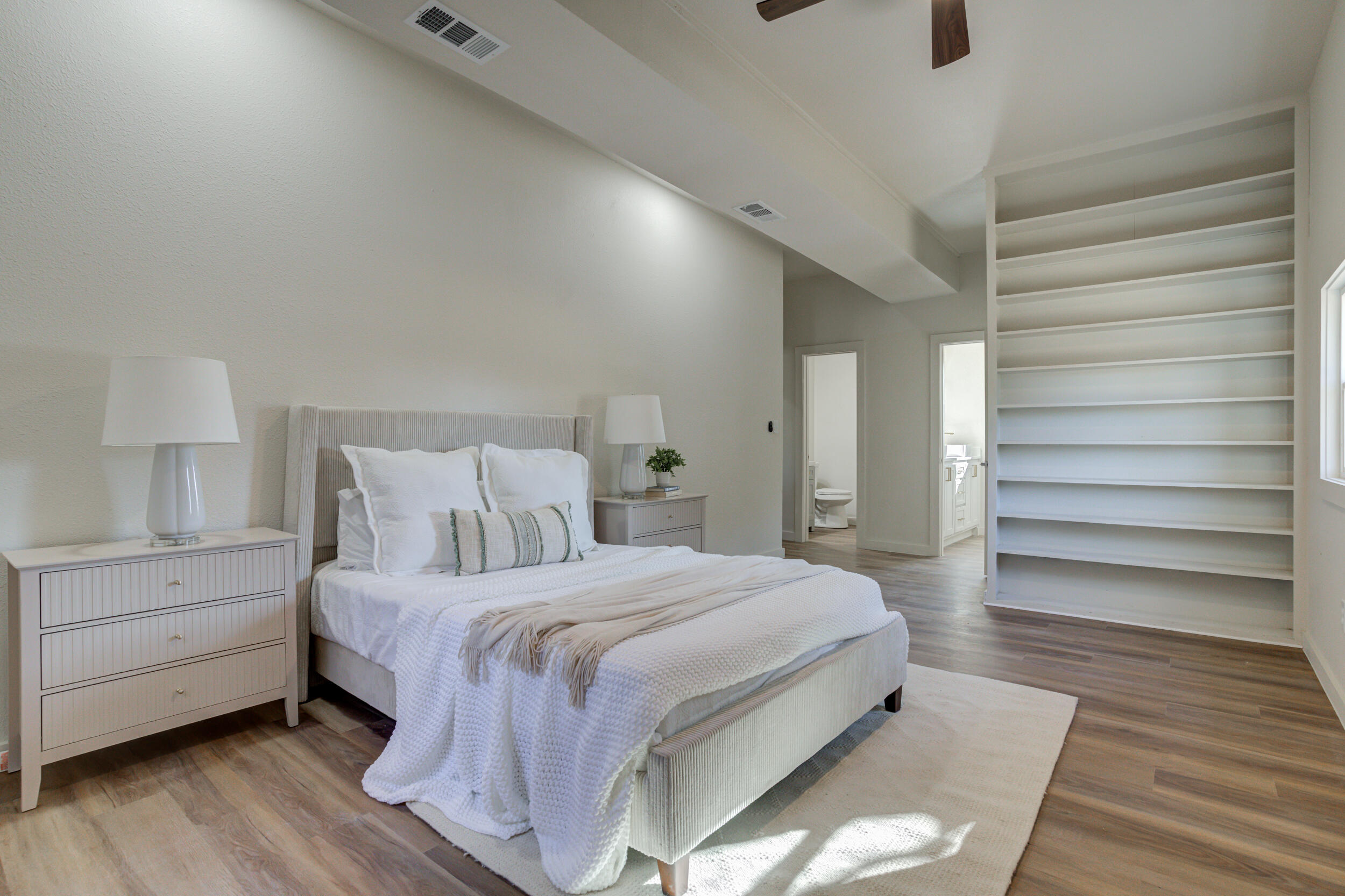 2218 58th Street Lubbock, TX 79412 - Photo 32 of 66 a bedroom with a bed and a night stand