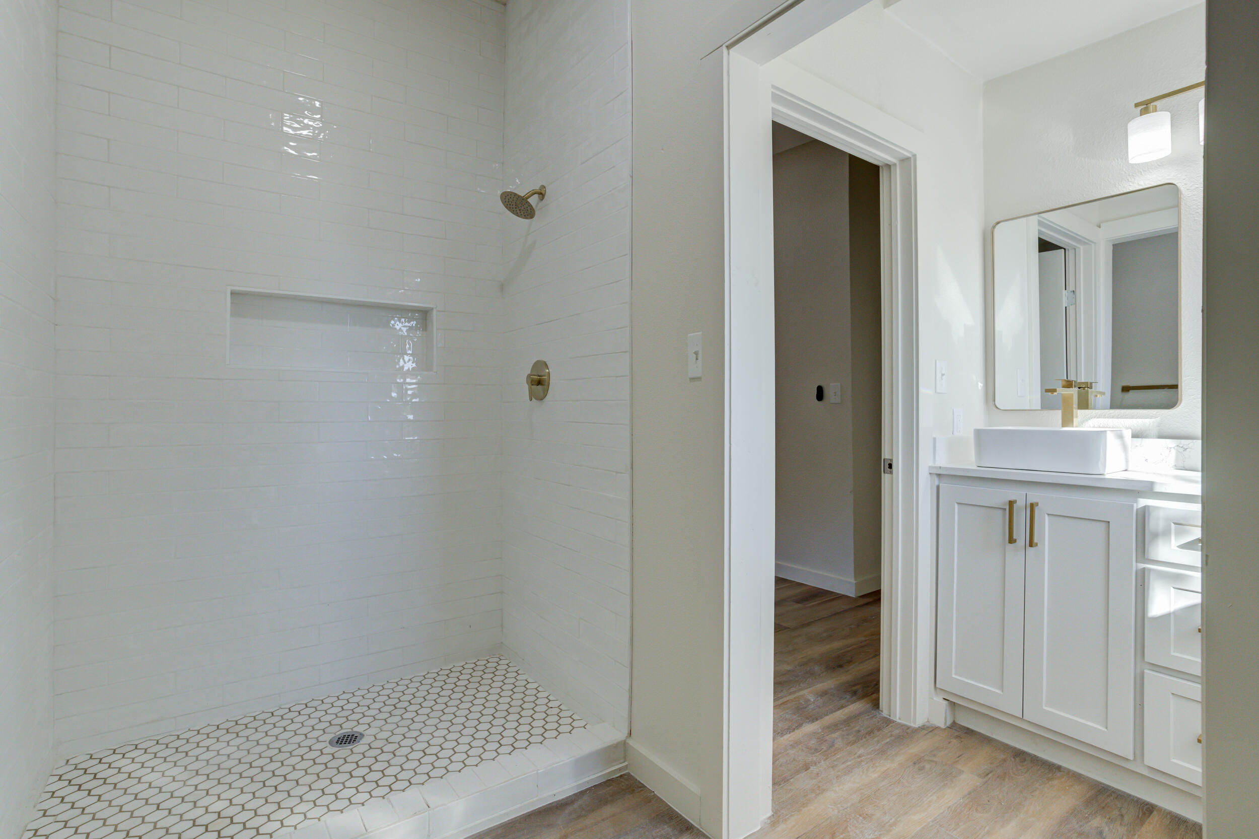 2218 58th Street Lubbock, TX 79412 - Photo 37 of 66 a bathroom with a shower