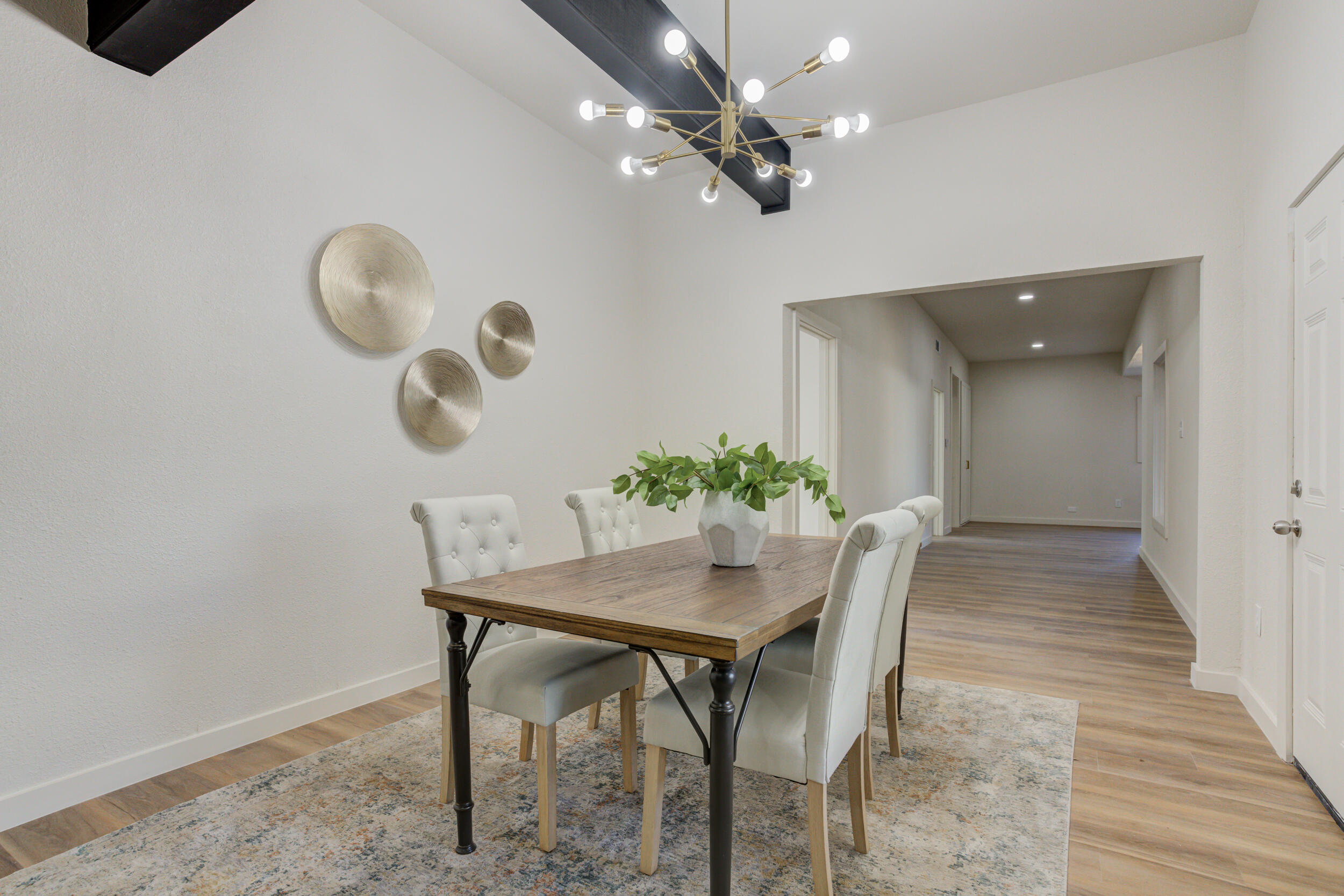 2218 58th Street Lubbock, TX 79412 - Photo 41 of 66 a view of a dining room with furniture and wooden floor