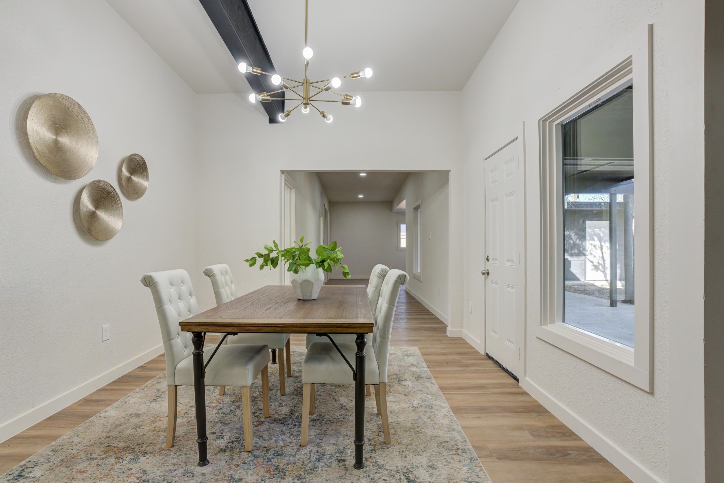 2218 58th Street Lubbock, TX 79412 - Photo 42 of 66 a view of a dining room with furniture and chandelier
