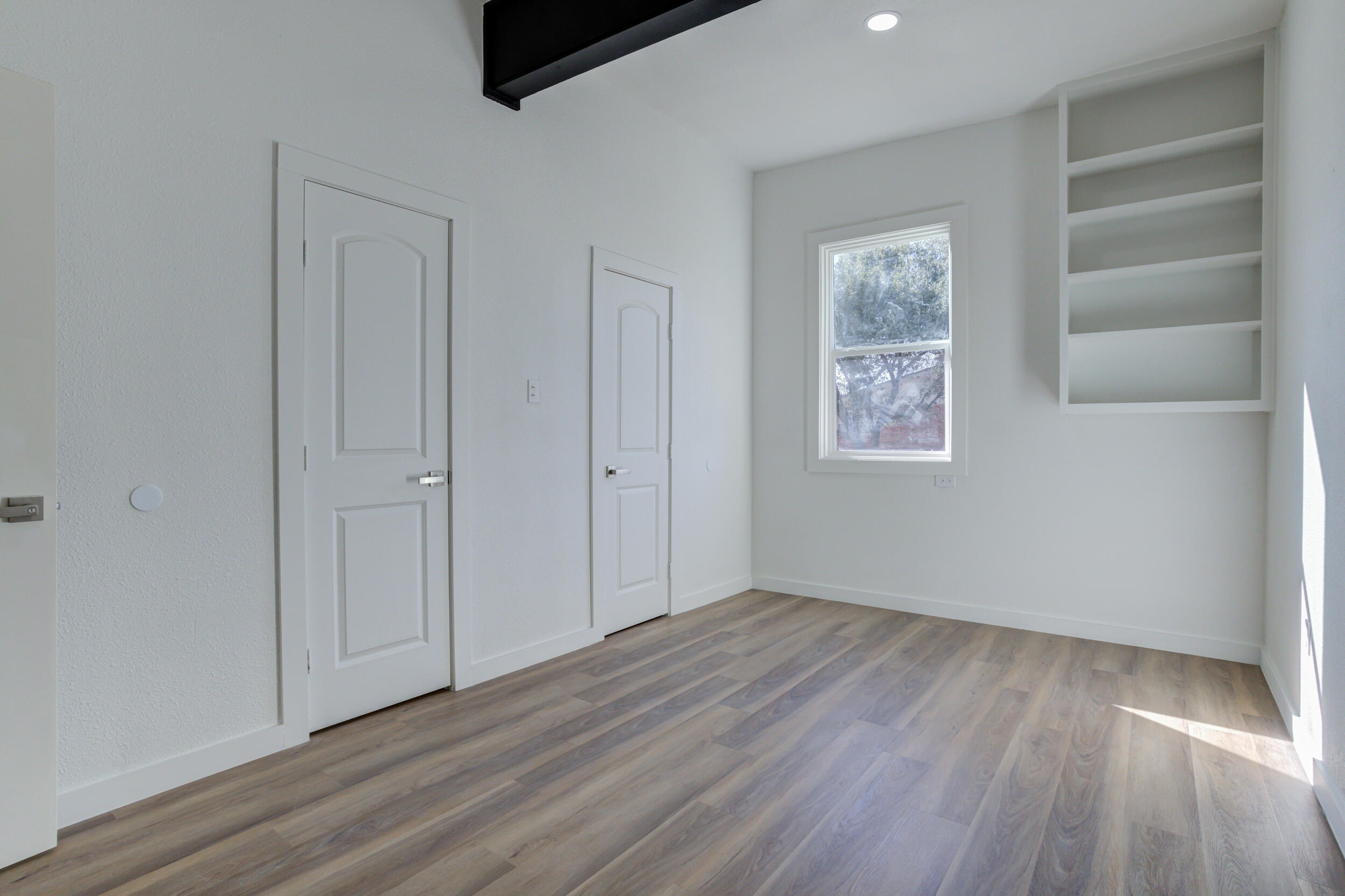 2218 58th Street Lubbock, TX 79412 - Photo 45 of 66 an empty room with windows and closet