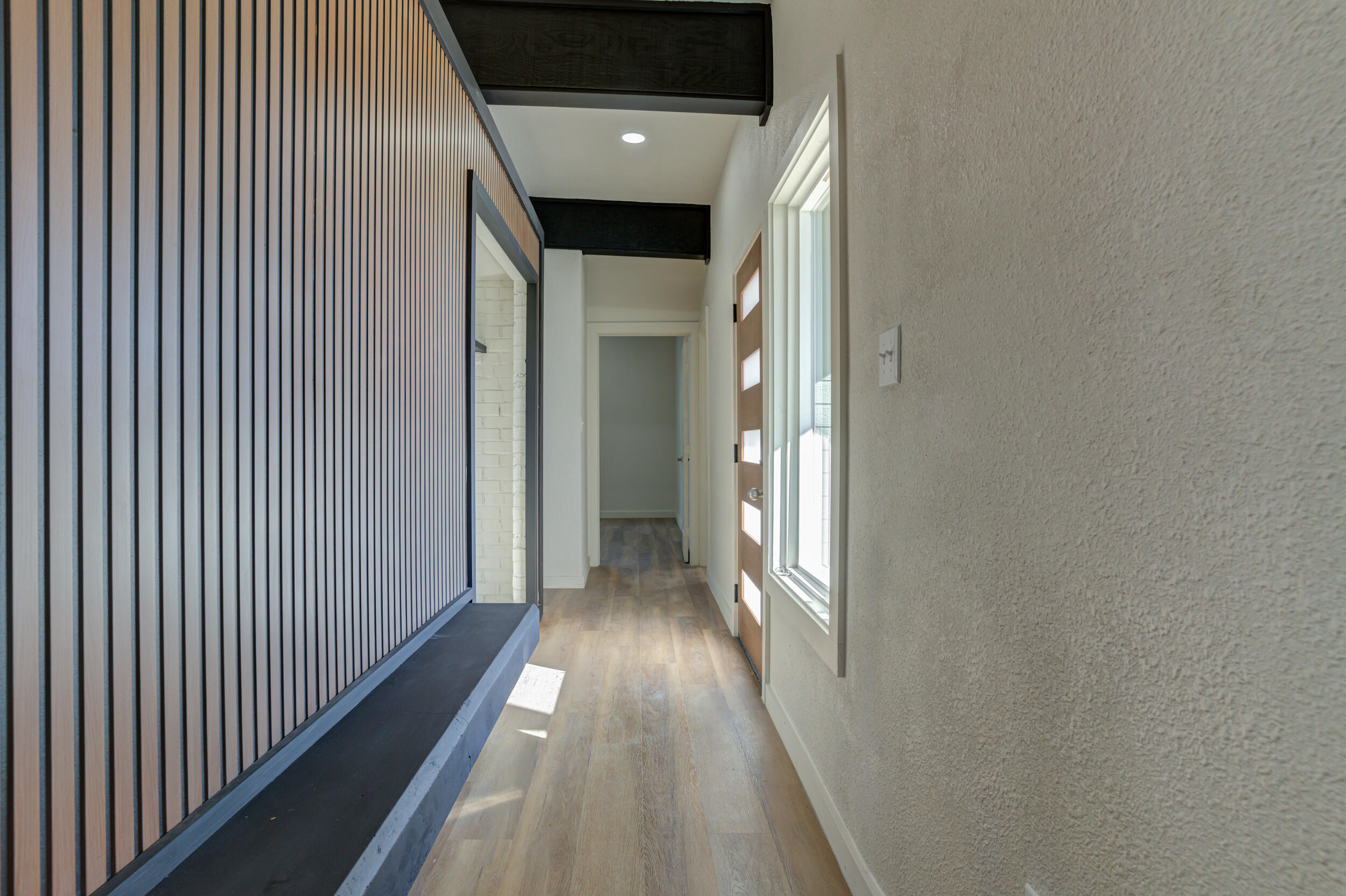 2218 58th Street Lubbock, TX 79412 - Photo 6 of 66 a view of a hallway with wooden floor