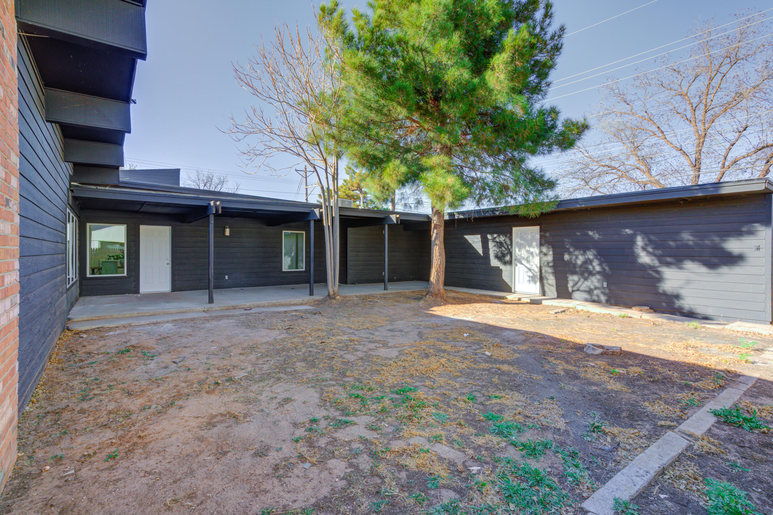2218 58th Street Lubbock, TX 79412 - Photo 62 of 66 a view of a house with a yard and garage