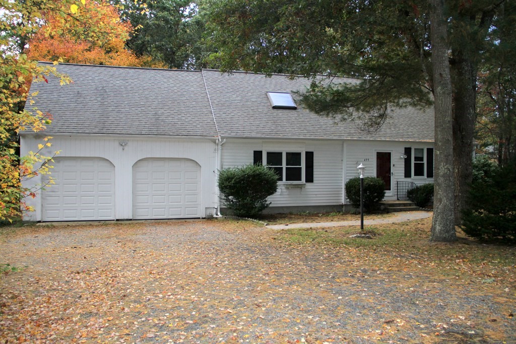 499 Skunknet Road Barnstable, MA 02632 - Photo 1 of 16 front view of a house with a yard