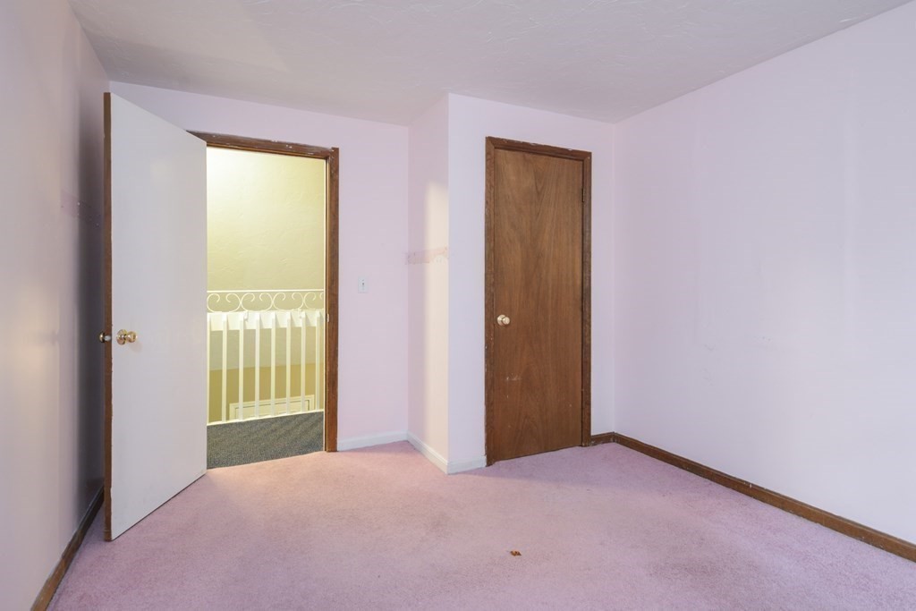 499 Skunknet Road Barnstable, MA 02632 - Photo 11 of 16 a view of an empty room with a window