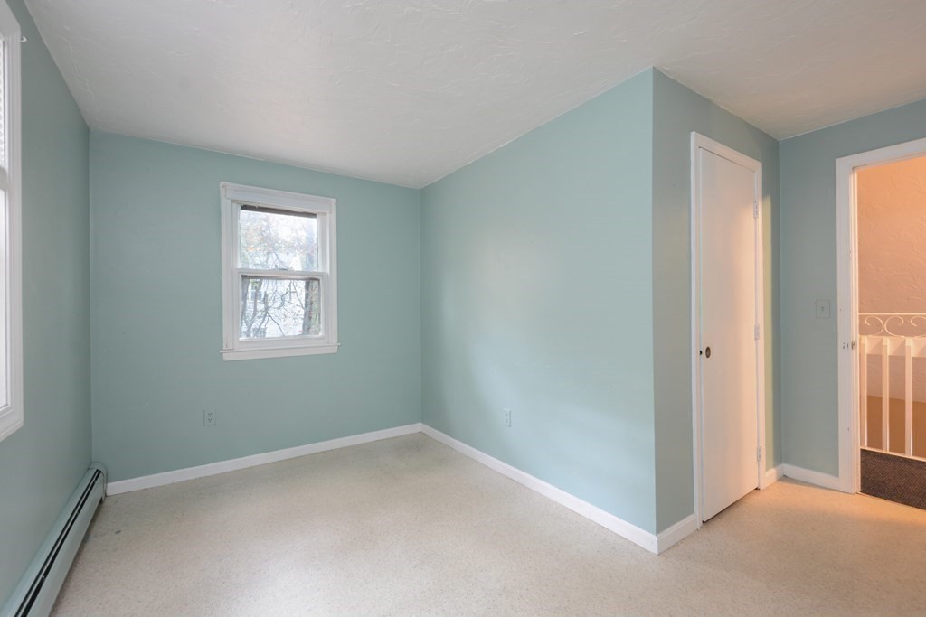 499 Skunknet Road Barnstable, MA 02632 - Photo 12 of 16 a view of an empty room with a window